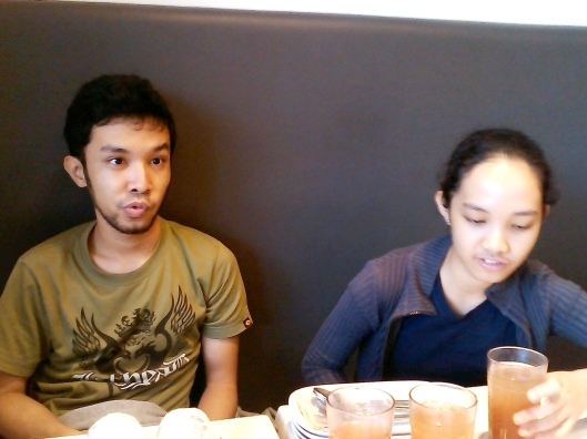 My son (Christian Mananes) and daughter (Genlie) enjoying our meal. Isn't it apparent in my son's face?